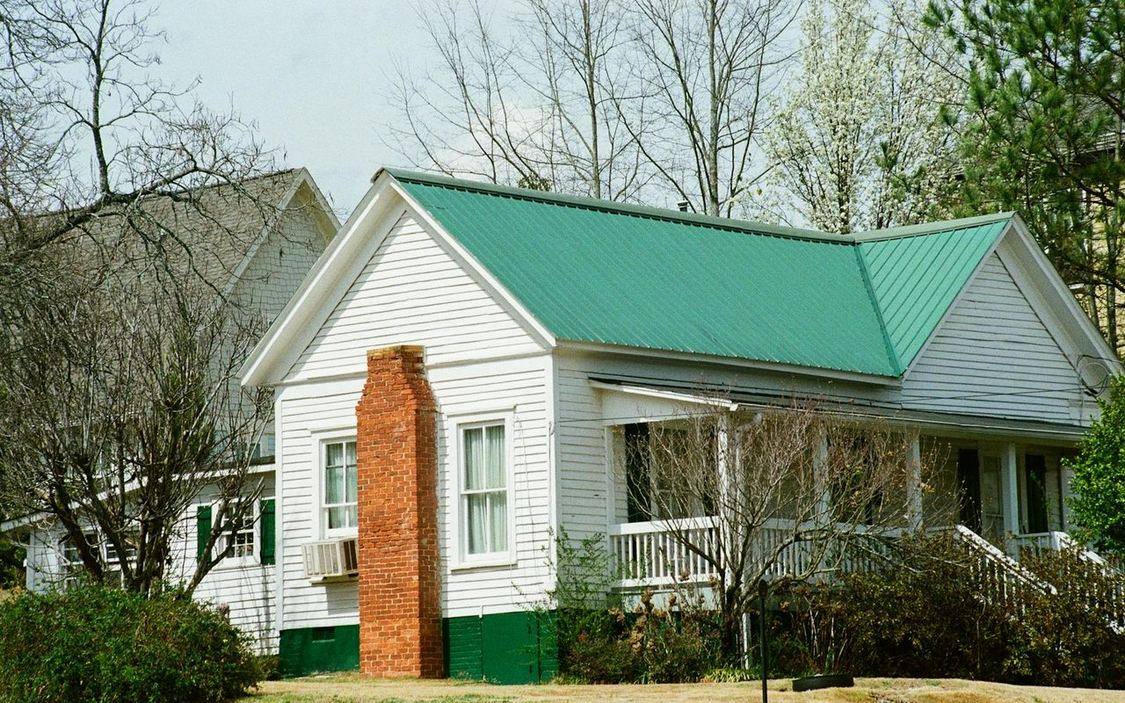 Residential home with a freshly installed standing seam metal roof