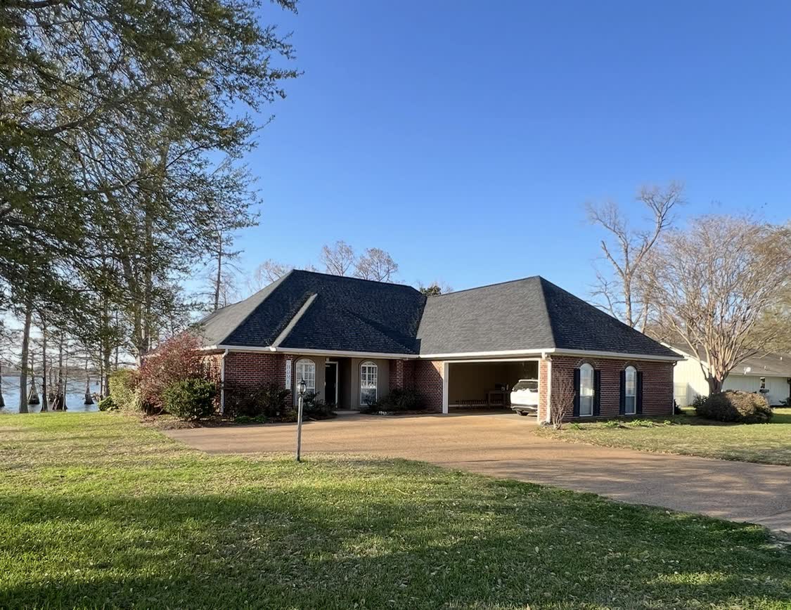 Brick home by the lake with finished new roof