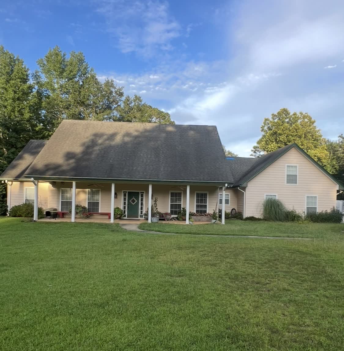 Tan country home with new architectural shingle roof